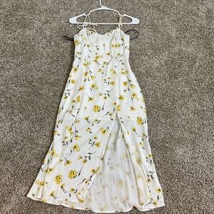 It’s a white dress with yellow flowers on it